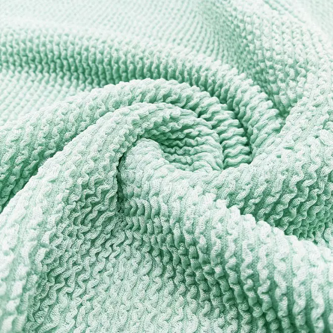 Polyester ammonia elastic stairs crepe fabric polyester single side jacquard fabric luggage Fashion swimsuit swimsuit knitted jacquard fabric (1).jpg