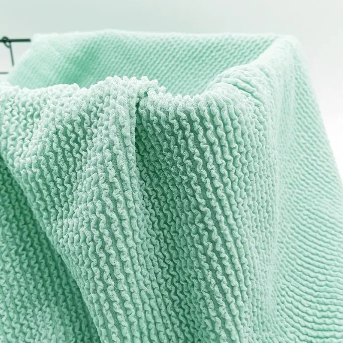 Polyester ammonia elastic stairs crepe fabric polyester single side jacquard fabric luggage Fashion swimsuit swimsuit knitted jacquard fabric (3).jpg